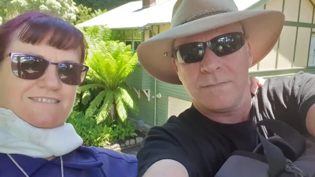 A selfie with Lynne David Hodgson with a man wearing a cowboy hat and black sunglasses