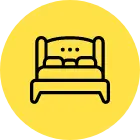 an icon of a bed with a pillow on top of it